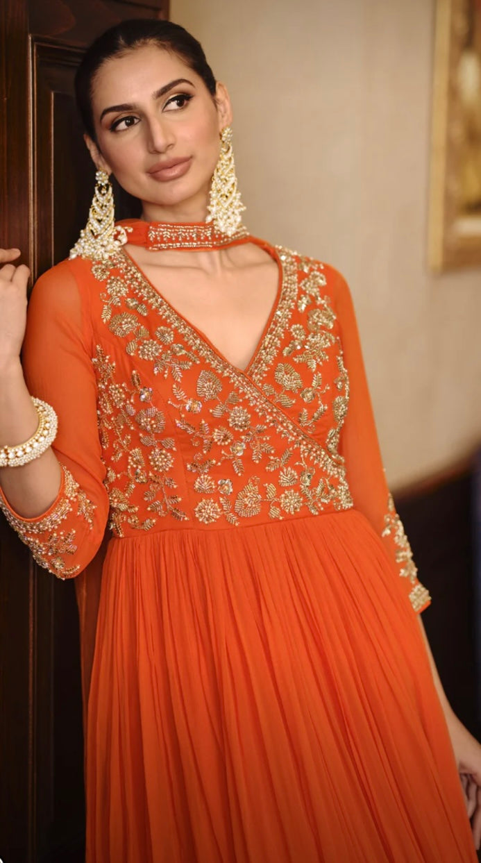 Trending orange coloured georgette stylish gown